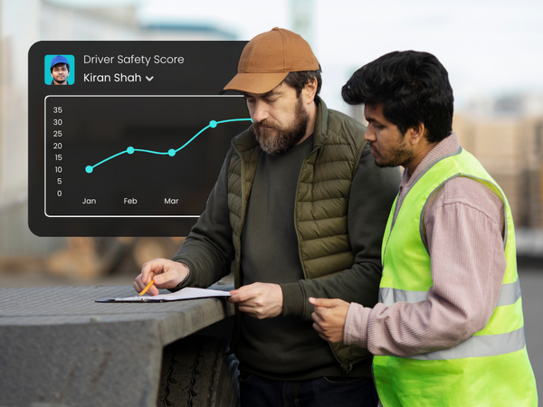 Fleet manager coaching a driver using an AI-powered driver safety score report.